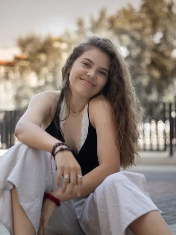 Young woman with curly hair outdoors
