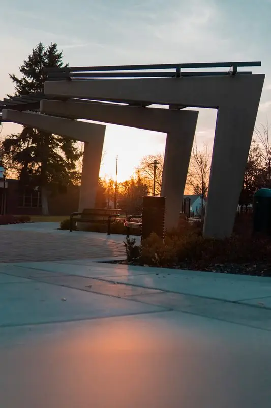 Concrete structure with benches at sunset