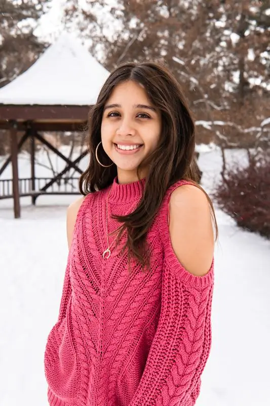 Young woman in pink in the snow