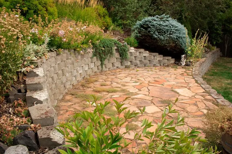 Landscaped garden with a stone wall
