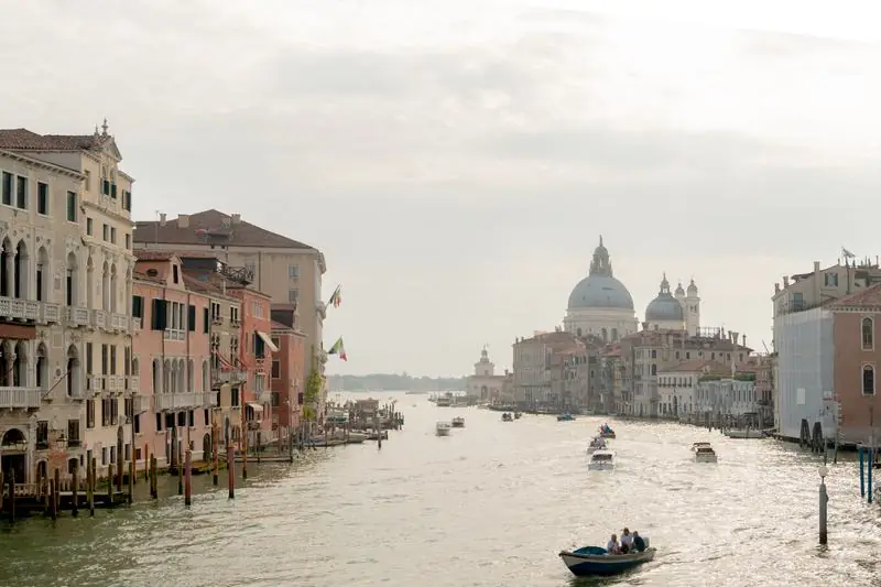 Venice Grand Canal with boats and historic buildings