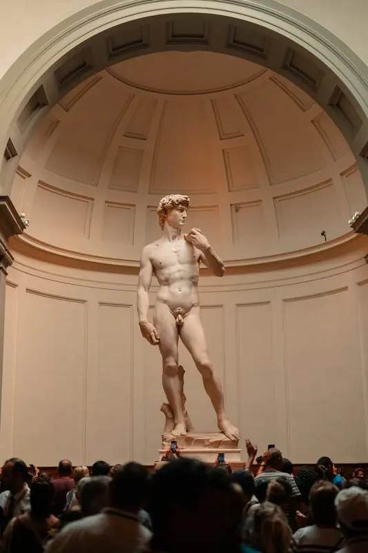 Michelangelo's David with a crowd looking at it