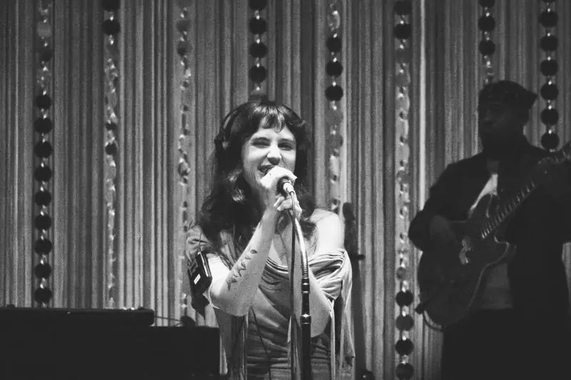 Black and white singer with guitarist