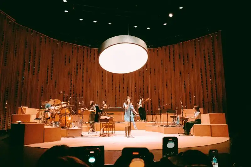 Band under a large circular light