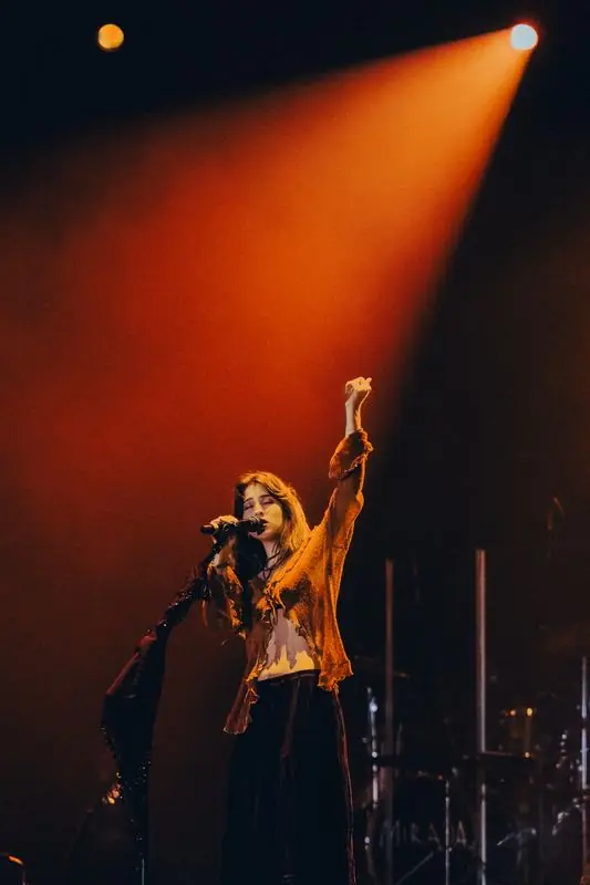 Singer with her arm raised