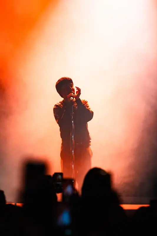 Singer in orange and red light