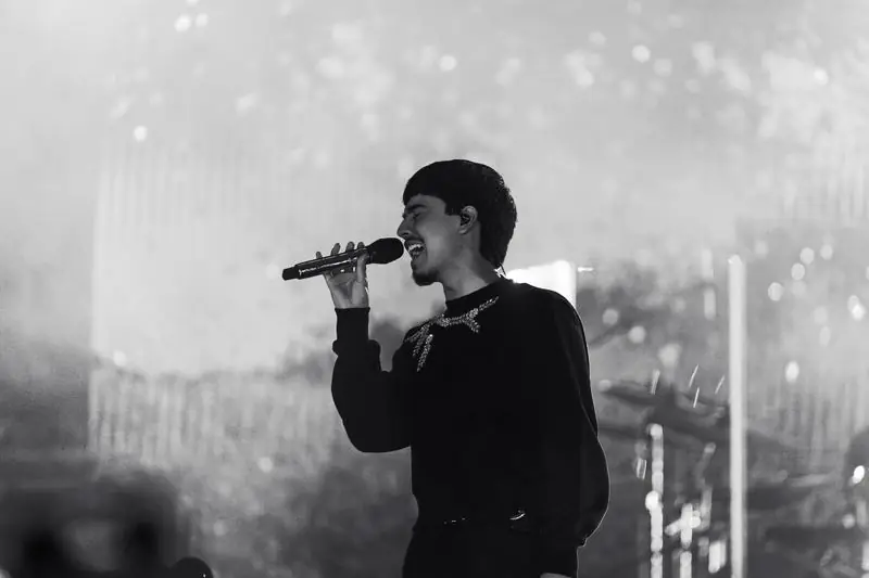 Male singer performing passionately