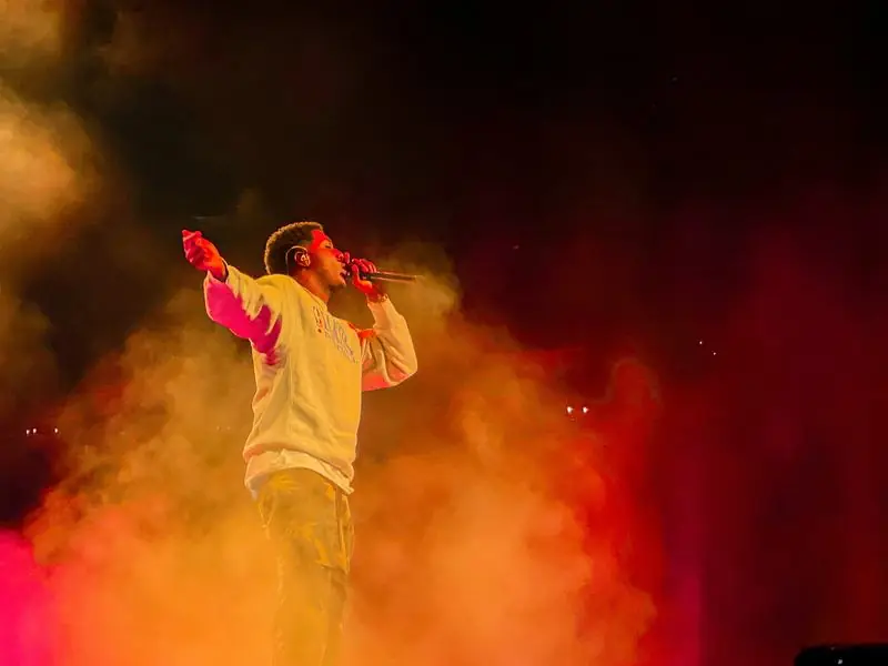Singer with smoke and red lighting